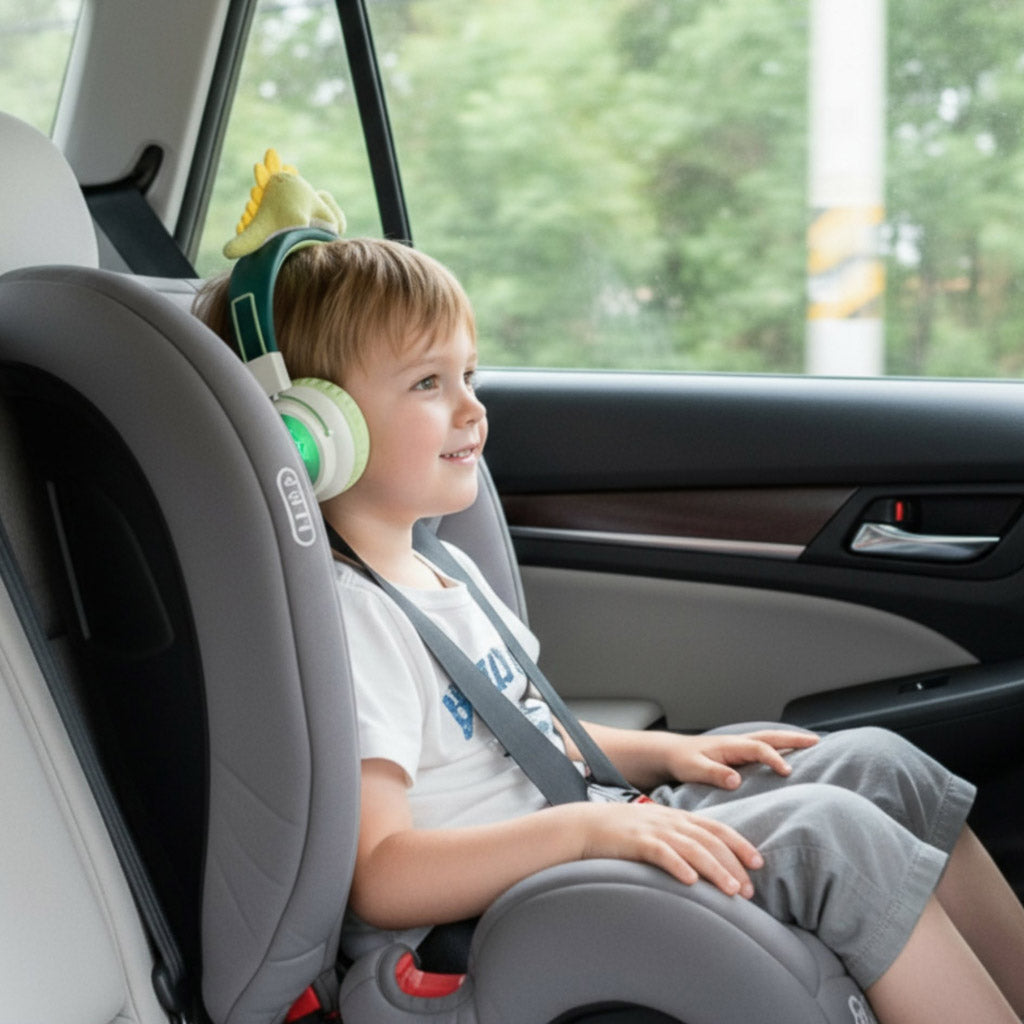 Child sitting in a car seat with Marckids ProtectedSound 85dB safe volume wireless Bluetooth kids headset