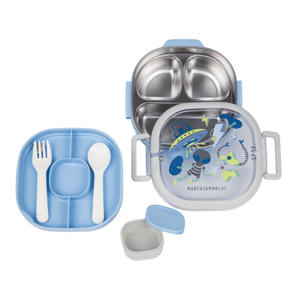 A children's lunch box set in pastel blue and light grey, featuring a stainless steel three-compartment bento container, a compartment plate with a white fork and spoon, a small blue container, and a lid with a colorful illustration.