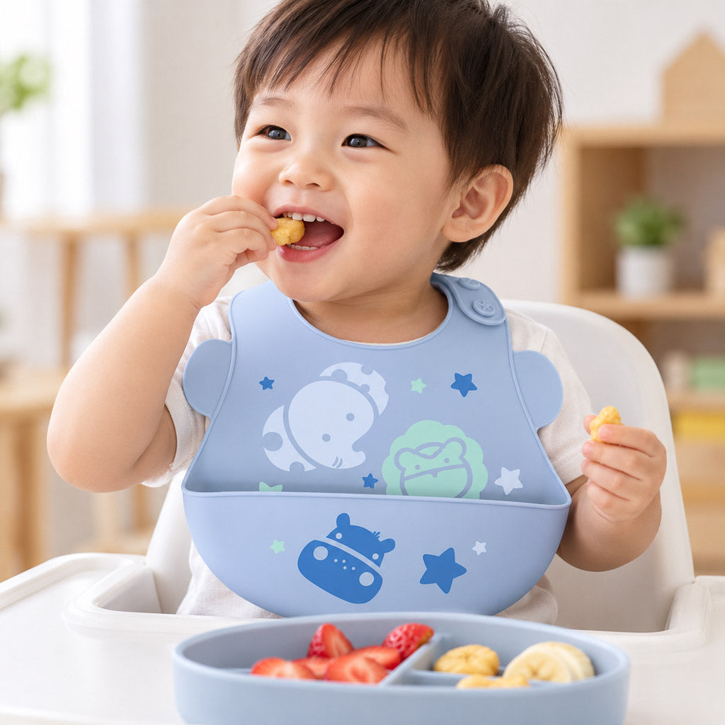 Joyful Toddler Mealtime in Blue Bib